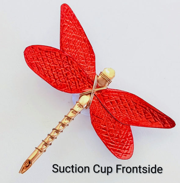 Red and copper dragon fly with suction up