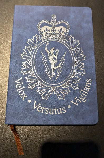 Blue leather journal with C&E crest