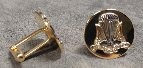Gold cufflinks with air ops crest; featuring silver parachute and gold wings and text.