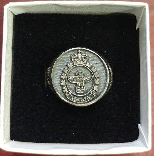 Silver ring with the Military Police Crest on it.