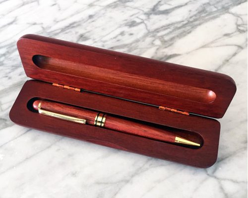Rosewood wood pen case with single pen.