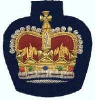 Gold embroidered warrant officer rank on blue background.