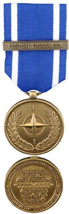 Front and back face of broze Nato medal. Also shown is the blue and white ribbon and bar for Former Yugoslavia.