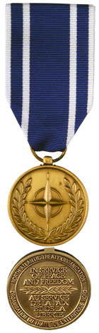 Front and back face of broze Nato medal. Also shown is the blue and white ribbon for Former Republic of Macedonia. (This medal does not come with a bar.)