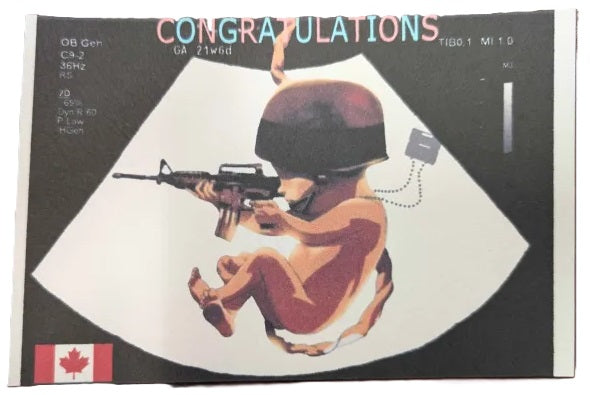 Ultrasound image of a fetus holding a rifle with a helmet, set against a black background with 'Congratulations' text.