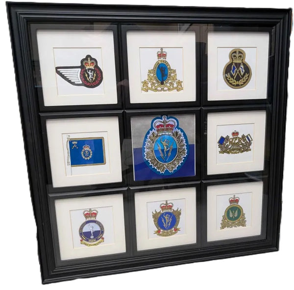 Framed picture with various painted/digital signal crests and emblems throughout the years