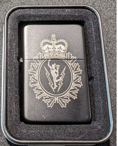 Zippo style lighter engraved with C&E Crst