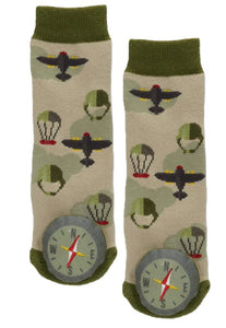 Green and beige socks with parachutes, airplanes, and comapas