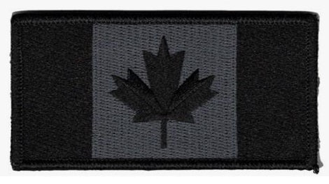 Black and gray Canadian flag patch on a black background