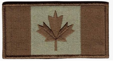 Patch of a Canadian flag with a brown maple leaf on a beige background