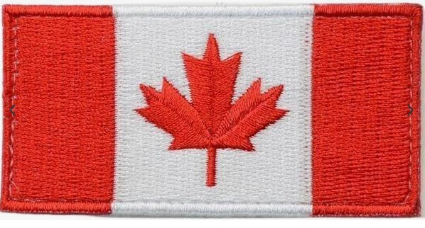 Embroidered patch of the Canadian flag with a red maple leaf on a white background.