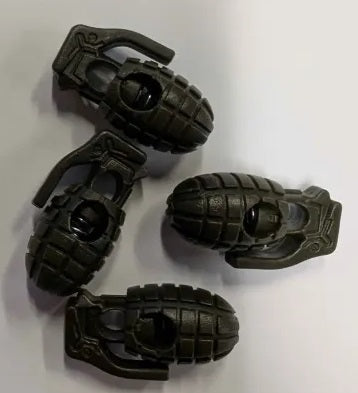 Four olive drab grenade-shaped cord stoppers on a white background