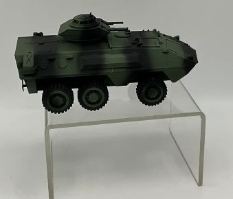 Model of a AVGP Grizzly military tank on a clear stand against a white background