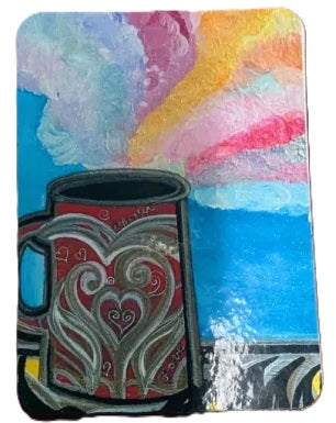 A colorful square artwork showing a stylized red mug with heart motifs in the foreground and a bright abstract sky in blue, pink, yellow, and white behind it.