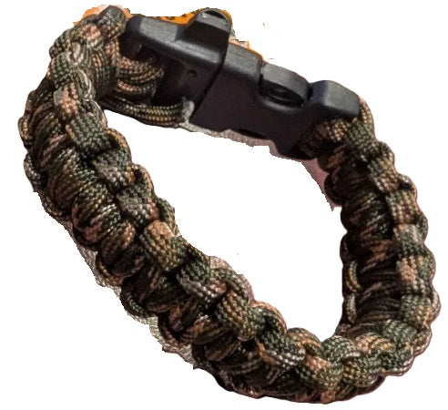Camouflage-patterned paracord bracelet with a black buckle on a white background