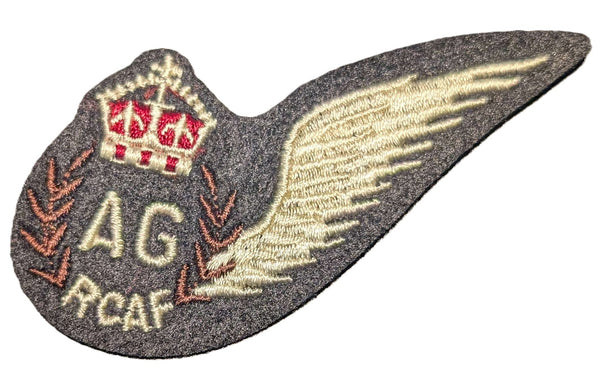 Embroidered patch with wings, AG RCAF letters, and a crest on a white background