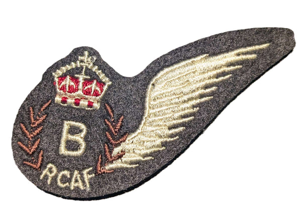 Embroidered patch with wings, crown, and 'B RCAF' text on a white background