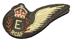 Embroidered patch with a wing design and RCAF logo on a white background