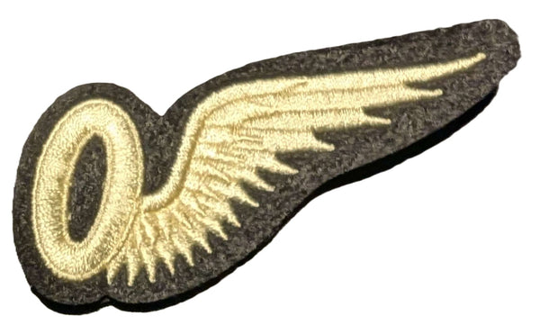 White winged O badge on a black background