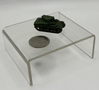 Model tank on a coin inside a clear acrylic display case on a white background