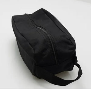 Black travel bag on a white background