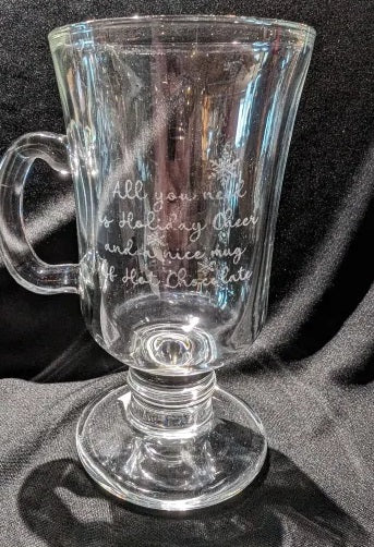 Engraved with "All you need is Holiday Cheer and a nice mug of Hot Chocolate"