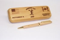 Maple wood pen case with single pen.