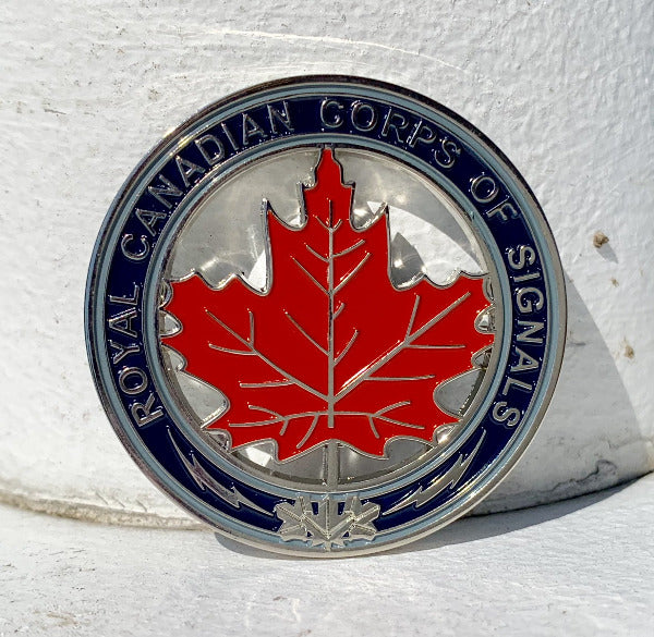Coin with red maple leaf in the center and text "Royal Canadian Corps of Signals" around the rim