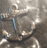 Silver anchor device.