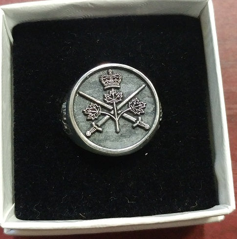 Silver ring with the Canadian Army crest.