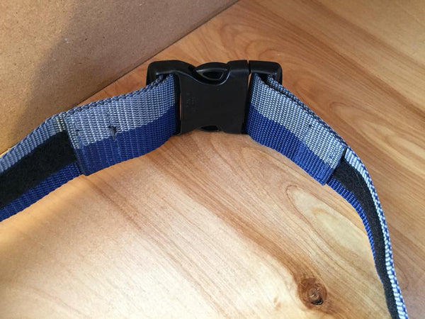 The inside of the grey and blue web belt. Featured is how the velcro ends are attached and can be adjusted for size.