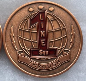 Bronze coin with red number 1with text "Line Sqn Thorough" over a globe.