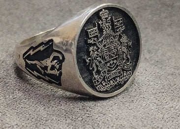 Silver ring with the Chief Warrant Officer crest and Merucry (Jimmy) with lightning bolts on the shoulder.