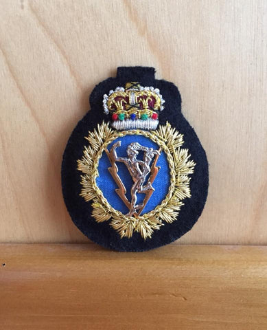 Hat badge for C&E Officer, at the center is a medal Mercury (Jimmy).