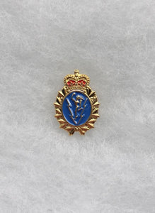 Gold and lapel pin in the shape of the C&E Crest