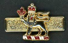 Gold pin featuring a lion wearing a red crown and holding red maple leaf.