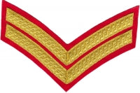 Gold embroidered corporal red guard rank on red background.
