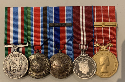 Court mounted medal rack featuring Peacekeeping, UNPROFOR, UNMIH with bar, QDJ, and CD with one bar