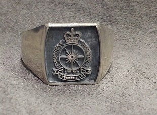 Silver ring with the Interligence Branch crest in the center.