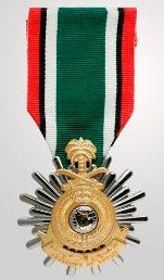 Front face of the silver and gold Saudi Arabian uwait Liberation Medal, also featured is the red, black, white, and green ribbon.