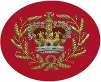 Gold embroidered master warrant officer rank on red background.