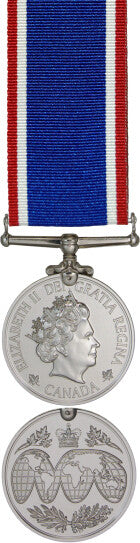 Front and back face of the silver operational service medal, also shown is the red, white, and blue Haiti ribbon.