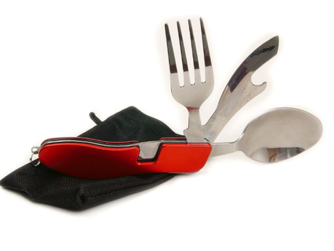 Fork, knife and spoon heads attached to a red handle. It is sitting on top of a small black bag.