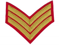 Gold embroidered red guard sergeant rank on red background.