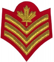 Gold embroidered sergeant rank on red background.