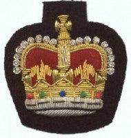 Gold embroidered warrant officer rank on black background.