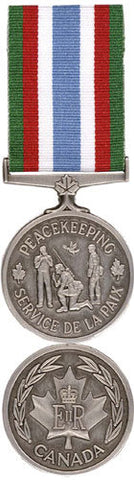 Front and back face of the silver Canadian Peace Keeping Medal as well as the green, red,white and blue ribbon.