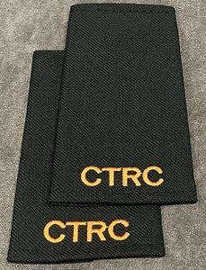 Cloth black shoulder titles with CTRC embroidered in gold and no rank.
