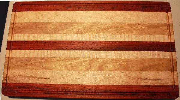 Square edge cutting board with dark and light wood.