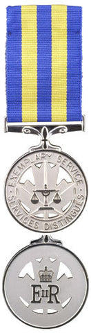 Front and back face of the silver Police eemplary service medal, also shown is the blue and yellow ribbon.